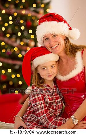 Mother and daughter at Christmas time View Large Photo Image Picture - Mother and daughter at Christmas time. Fotosearch