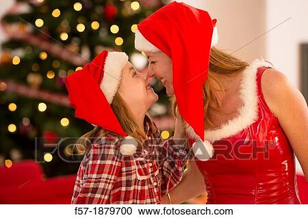 Mother and daughter at Christmas time View Large Photo Image Stock Image - Mother and daughter at Christmas time. Fotosearch