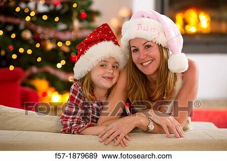 Mother and daughter at Christmas time View Large Photo Image Stock Photo - Mother and daughter at Christmas time. Fotosearch