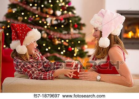 Mother and daughter at Christmas time View Large Photo Image Stock Photo - Mother and daughter at Christmas time. Fotosearch