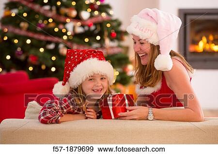 Mother and daughter at Christmas time View Large Photo Image Stock Photo - Mother and daughter at Christmas time. Fotosearch