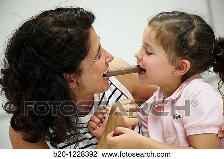 Mother and daughter eating a chocolate bar, tasting session in sensory analysis lab, AZTI-Tecnalia Marine and Food Research Center, Derio, Bizkaia, Euskadi, Spain View Large Photo Image Stock Image - Mother and daughter eating a chocolate bar, tasting session in sensory analysis lab, AZTI-Tecnalia Marine and Food Research Center, Derio, Bizkaia, Euskadi, Spain. Fotosearch