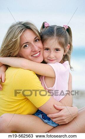 mother and daughter embracing View Large Photo Image Stock Image - mother and daughter embracing. Fotosearch
