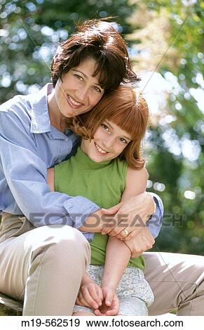mother and daughter embracing View Large Photo Image Stock Photo - mother and daughter embracing. Fotosearch
