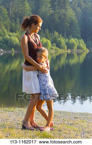 Stock Photo - Mother and daughter embracing. Fotosearch