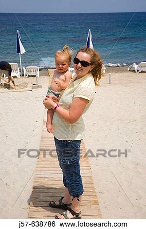 Mother and Daughter enjoying the resort beach in Kos Island. Greece. View Large Photo Image Stock Photograph - Mother and Daughter enjoying the resort beach in Kos Island. Greece.. Fotosearch