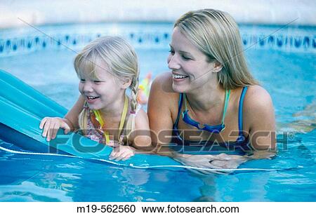 mother and daughter in a pool View Large Photo Image Stock Image - mother and daughter in a pool. Fotosearch