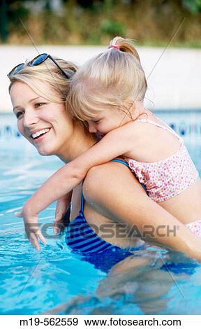 mother and daughter in a pool View Large Photo Image Stock Photo - mother and daughter in a pool. Fotosearch