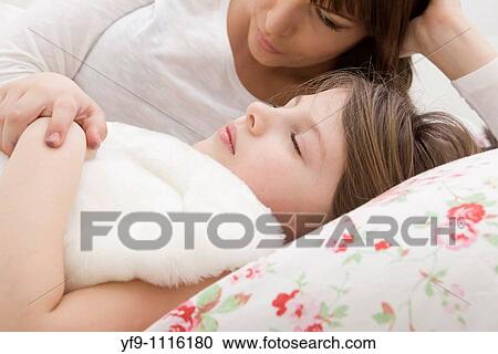 Mother and daughter in bed. View Large Photo Image Stock Image - Mother and daughter in bed.. Fotosearch