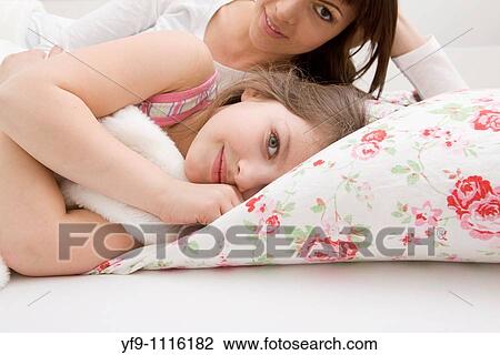 Mother and daughter in bed. View Large Photo Image Stock Image - Mother and daughter in bed.. Fotosearch