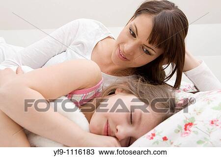 Mother and daughter in bed. View Large Photo Image Stock Image - Mother and daughter in bed.. Fotosearch