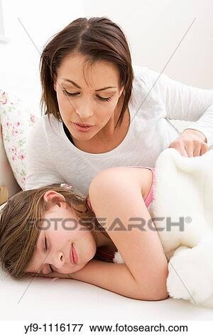 Mother and daughter in bed. View Large Photo Image Stock Photo - Mother and daughter in bed.. Fotosearch