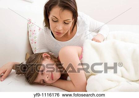 Mother and daughter in bed. View Large Photo Image Stock Photograph - Mother and daughter in bed.. Fotosearch