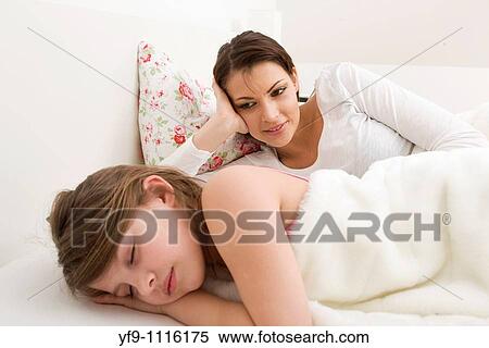 Mother and daughter in bed. View Large Photo Image Stock Photography - Mother and daughter in bed.. Fotosearch