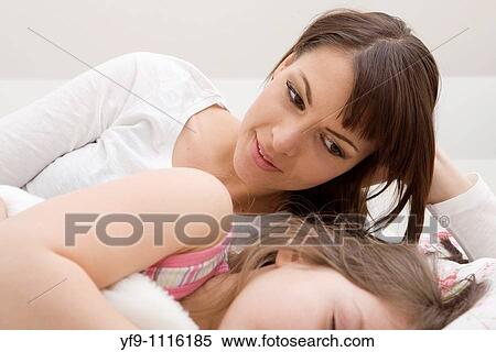 Mother and daughter in bed. View Large Photo Image Stock Photography - Mother and daughter in bed.. Fotosearch