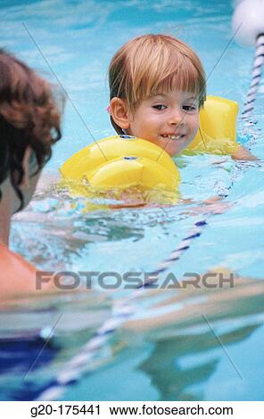 Mother and daughter in swimming pool View Large Photo Image Stock Image - Mother and daughter in swimming pool. Fotosearch