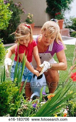 Mother and daughter in the garden View Large Photo Image Stock Photograph - Mother and daughter in the garden. Fotosearch