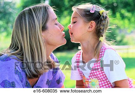 Mother and daughter kissing View Large Photo Image Stock Photography - Mother and daughter kissing. Fotosearch