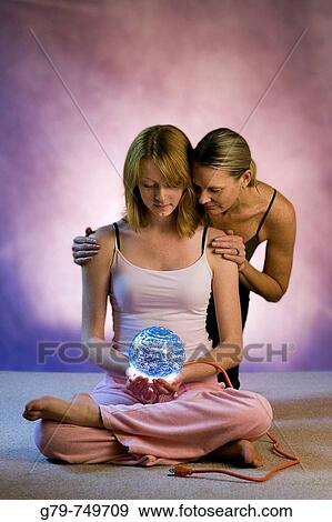 Mother and daughter looking at a globe of the earth View Large Photo Image Stock Photo - Mother and daughter looking at a globe of the earth. Fotosearch
