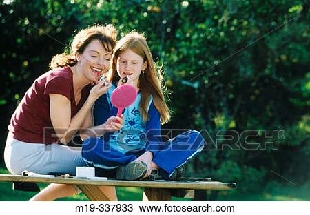 Mother and daughter making up View Large Photo Image Stock Image - Mother and daughter making up. Fotosearch