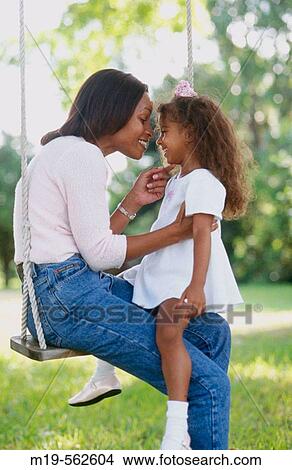 mother and daughter on a swing View Large Photo Image Picture - mother and daughter on a swing. Fotosearch