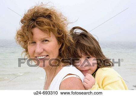 Mother and Daughter on Beach View Large Photo Image Stock Image - Mother and Daughter on Beach. Fotosearch