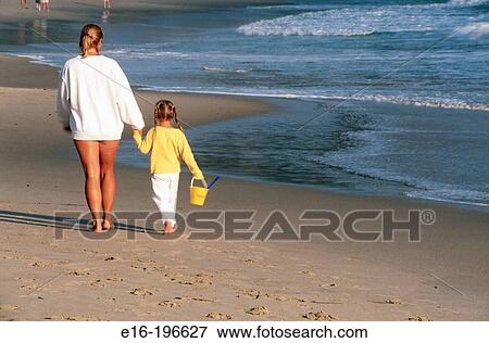 Mother and daughter on beach View Large Photo Image Stock Photo - Mother and daughter on beach. Fotosearch