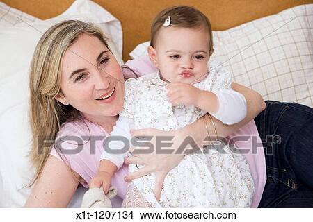 Mother and daughter. View Large Photo Image Picture - Mother and daughter.. Fotosearch