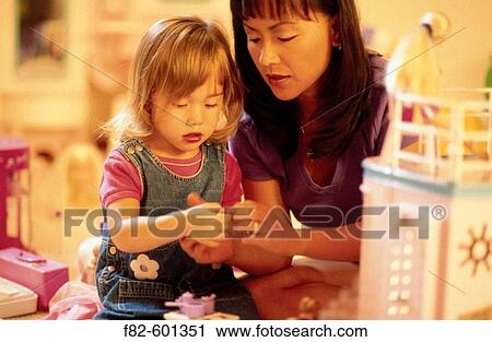 Mother and daughter playing View Large Photo Image Stock Image - Mother and daughter playing. Fotosearch