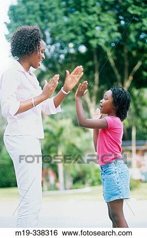 Mother and daughter playing View Large Photo Image Stock Photograph - Mother and daughter playing. Fotosearch