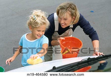 mother and daughter washing a car View Large Photo Image Stock Image - mother and daughter washing a car. Fotosearch