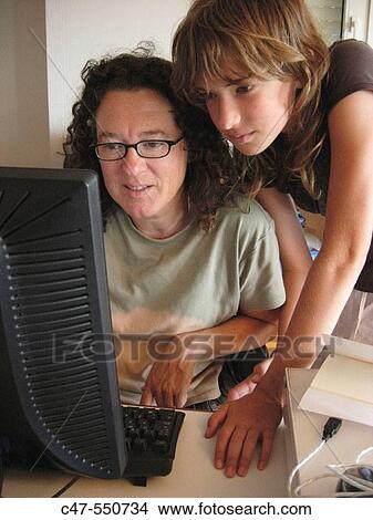 Mother and daughter with desktop computer View Large Photo Image Picture - Mother and daughter with desktop computer. Fotosearch