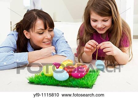 Mother and daughter with Easter eggs. View Large Photo Image Stock Image - Mother and daughter with Easter eggs.. Fotosearch