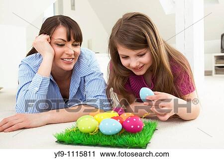 Mother and daughter with Easter eggs. View Large Photo Image Stock Image - Mother and daughter with Easter eggs.. Fotosearch