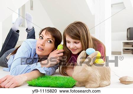 Mother and daughter with Easter eggs and rabbit. View Large Photo Image Stock Image - Mother and daughter with Easter eggs and rabbit.. Fotosearch