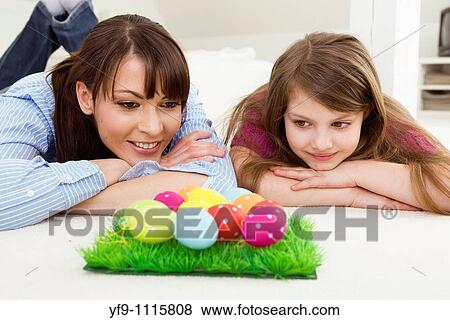 Mother and daughter with Easter eggs. View Large Photo Image Stock Photo - Mother and daughter with Easter eggs.. Fotosearch