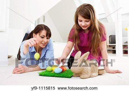 Mother and daughter with Easter eggs and rabbit. View Large Photo Image Stock Photography - Mother and daughter with Easter eggs and rabbit.. Fotosearch