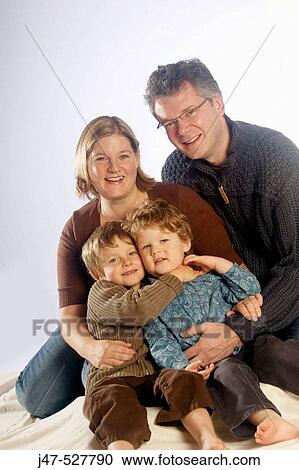 Mother and father with their two sons, aged 4 and 2 View Large Photo Image Stock Image - Mother and father with their two sons, aged 4 and 2. Fotosearch