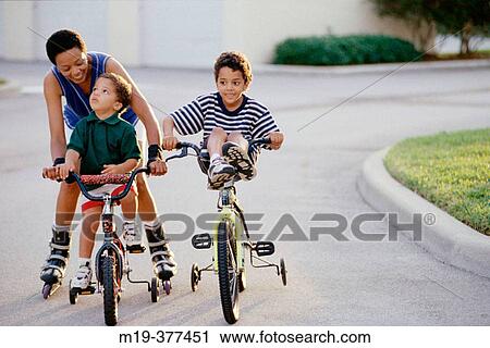 mother and her 2 kids on bicycles View Large Photo Image Stock Image - mother and her 2 kids on bicycles. Fotosearch