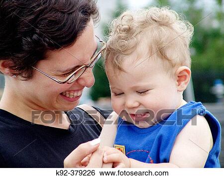 Mother and her one year old son View Large Photo Image Stock Photograph - Mother and her one year old son. Fotosearch