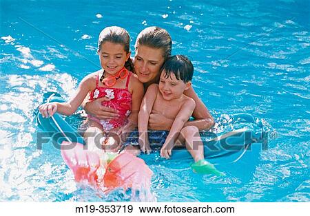 mother and kids in a pool View Large Photo Image Stock Photo - mother and kids in a pool. Fotosearch