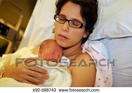 Mother and newborn baby in hospital View Large Photo Image Stock Image - Mother and newborn baby in hospital. Fotosearch