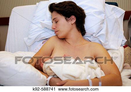 Stock Image - Mother and newborn baby in the hospital. Fotosearch