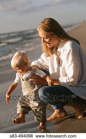 Mother and son at beach View Large Photo Image Stock Photo - Mother and son at beach. Fotosearch