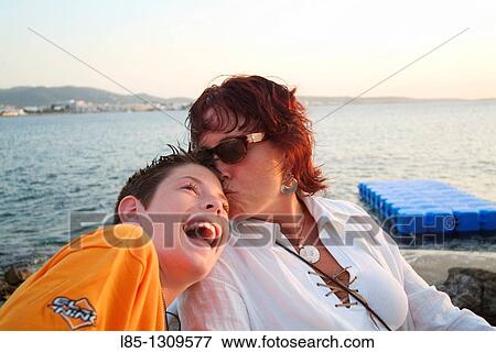 Mother and son at sunset, Ibiza, Balearic Islands, Spain View Large Photo Image Stock Photo - Mother and son at sunset, Ibiza, Balearic Islands, Spain. Fotosearch
