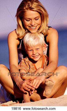 Mother and son at the beach View Large Photo Image Stock Photograph - Mother and son at the beach. Fotosearch