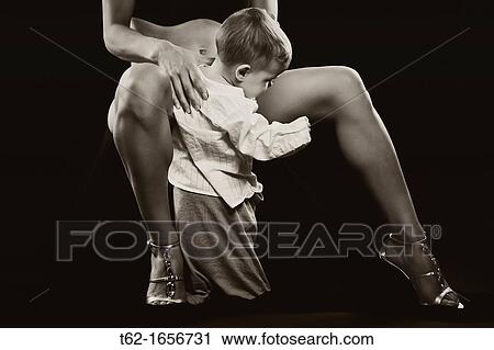 Mother and son Children playing between the legs of his mother View Large Photo Image Stock Image - Mother and son Children playing between the legs of his mother. Fotosearch