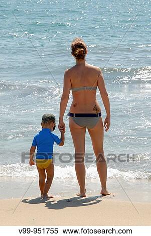 mother and son facing the sea View Large Photo Image Stock Photography - mother and son facing the sea. Fotosearch
