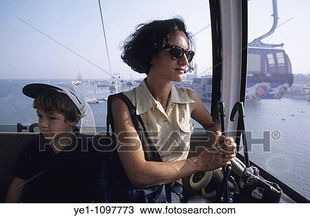 Stock Image - Mother and son inside a cable car at Expo 98, Lisbon, Portugal.. Fotosearch