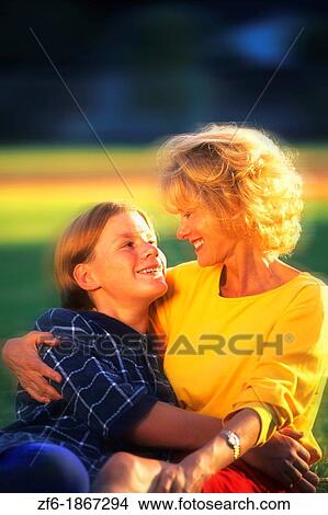 Mother and Son Outside Hugging with Love View Large Photo Image Picture - Mother and Son Outside Hugging with Love. Fotosearch